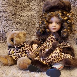 Porcelain doll with bear